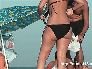 naked beach spycam vid of super-hot playful nudists in water