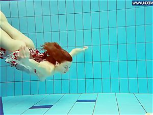 steamy grind redhead swimming in the pool